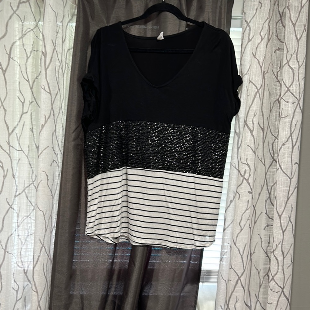 CY fashion shirt. No size listed. Fits medium/large.  Black/sparkle/stripes.